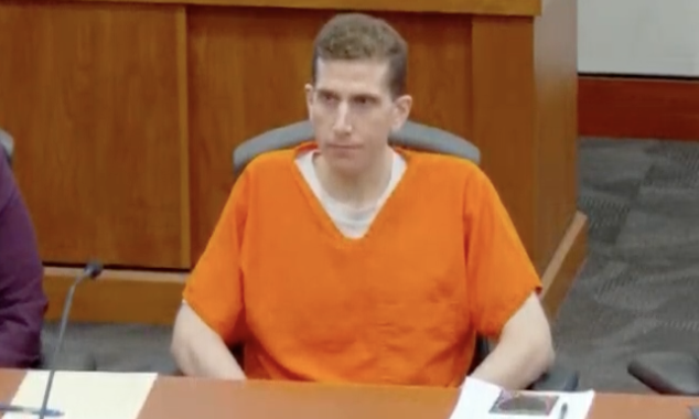Bryan Kohberger in orange prison attire seated in a courtroom at his sentencing for the Idaho murders.